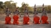 A screen shot from an Islamic State propaganda video purports to show young boys executing a group of captives.
