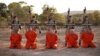 A screen shot from an Islamic State propaganda video purports to show young boys executing a group of captives.