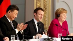 Dari kiri: Presiden China Xi Jinping, Presiden Perancis Emmanuel Macron, dan Kanselir Jerman Angela Merkel dalam pertemuan di Paris (foto: dok).