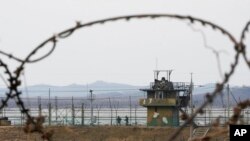 South Korean army soldiers patrol along the barbed-wire fence in Paju, near the border with North Korea, in South Korea. North Korea fired a suspected ballistic missile into the sea, the South Korean and Japanese militaries said.