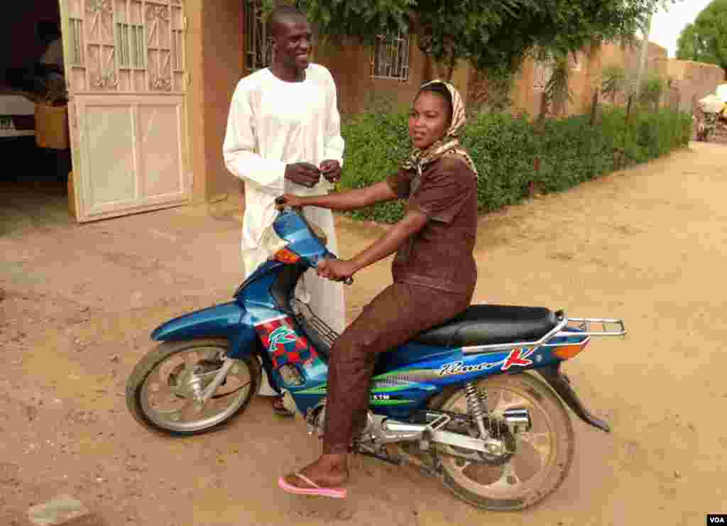 On a scooter: Nafissatou Maiga, a teacher from Menaka now stuck in Gao. (Idriss Fall/VOA)