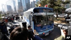 A bus carrying Cho Hyun-ah, former vice president of Korean Air Lines Co., arrives for her trial at the Seoul Western District Court in Seoul, South Korea, Monday, Feb. 2, 2015.