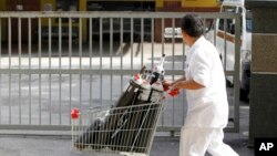 A medical worker pushes a trolley outside forensic department at Kuala Lumpur Hospital in Kuala Lumpur, Malaysia, March 28, 2017. 
