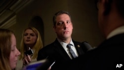 FILE - Rep. Tim Ryan speaks to reporters following the House Democratic Caucus elections for House leadership positions, on Capitol Hill in Washington, Nov. 30, 2016. Ryan challenged House Minority Leader Nancy Pelosi of California., but lost, 134-63.