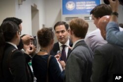 Sen. Marco Rubio, R-Fla., arrives for party policy meetings regarding the Senate Republican health care bill at the Capitol in Washington, June 27, 2017.