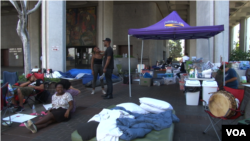 Activists in Los Angeles have been holding a sit-in at City Hall, demanding that Police Chief Charlie Beck resign over a police shooting last year of an African-American woman. Police said the woman was wielding a knife and that the shooting was justified. (E. Lee/VOA)