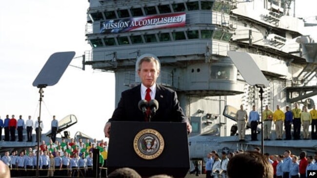 FILE - President Bush declares the end of major combat in Iraq as he speaks aboard the aircraft carrier USS Abraham Lincoln off the California coast, May 1, 2003.