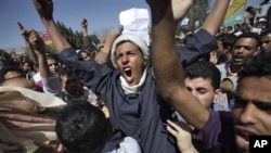 Yemeni anti-government demonstrators shout slogans during a demonstration demanding the resignation of President Ali Abdullah Saleh, in Sana'a, Yemen, February 19, 2011