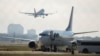 An airplane chartered to transport people to Haiti prepares to board passengers at the San Antonio International Airport as U.S. authorities accelerate the removal of migrants at the border with Mexico, in San Antonio, Texas, Sept. 20, 2021.