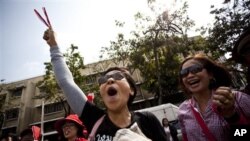 Thai anti-government protestors march at a Red Shirt protest rally in Bangkok, Thailand, February 19, 2011