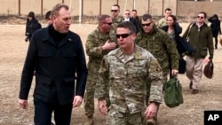 Acting Defense Secretary Pat Shanahan, left, arrives in Kabul, Afghanistan, Feb. 11, 2019, to consult with Army Gen. Scott Miller, right, commander of U.S. and coalition forces, and senior Afghan government leaders.