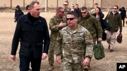 Acting Defense Secretary Pat Shanahan, left, arrives in Kabul, Afghanistan, Feb. 11, 2019, to consult with Army Gen. Scott Miller, right, commander of U.S. and coalition forces, and senior Afghan government leaders. 