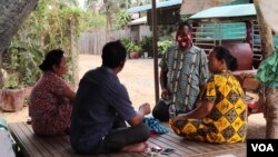 Tuk-tuk driver Hy Sokhom, 50, who is wearing a face mask, struggles to pay off his debt during the COVID-19 pandemic, Kien Svay district, Kandal province, Cambodia, April 12, 2020. (Phorn Bopha/VOA Khmer)