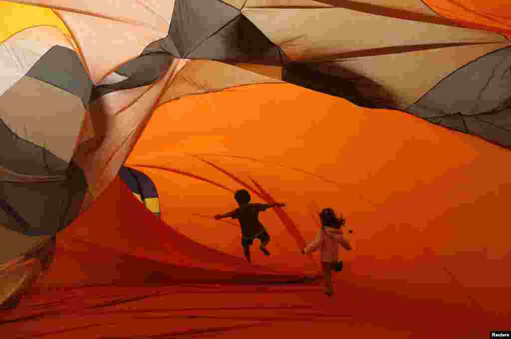Children play inside inflatable installations at the Casa Daros museum in Rio de Janeiro. 