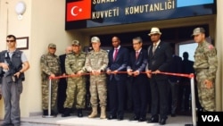Somali Prime Minister Hassan Ali Khaire and the Chief of the Turkish military, General Hulusi Akar, in Uniform, along with Turkish Ambassador to Somalia, Olgan Bekar, jointly cut the ribbon for the inauguration of Turkey’s largest foreign military base in