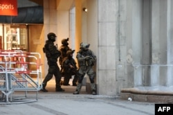 Police secures the area of a subway station Karlsplatz (Stachus) near a shopping mall following a shooting on July 22, 2016 in Munich.