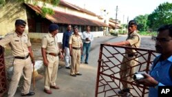 Indian policemen guard outside the Nagpur Central Prison, where the 1993 Mumbai blasts convict Yakub Abdul Razak Memon was held, in Nagpur, India, Wednesday, July 29, 2015.