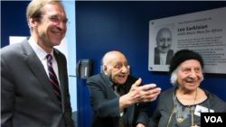 FILE - Leo Sarkisian, center, his wife, Mary, and VOA Director David Ensor smile during a celebration that followed the renaming of VOA Studio 23 in Sarkisian's honor, Jan. 29, 2014. 