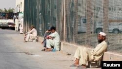 Saudi authorities say "cover-up" firms perpetuate unemployment for many, such as these laborers in Riyadh, June 18, 2013.