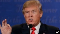 Republican Donald Trump and Democrat Hillary Clinton take part in the third and final presidential debate, held at the University of Nevada, Las Vegas, Oct. 19, 2016.