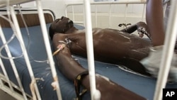 AIDS victim is washed in Dakar hospital ward that specializes in HIV treatment, Senegal (undated file photo).