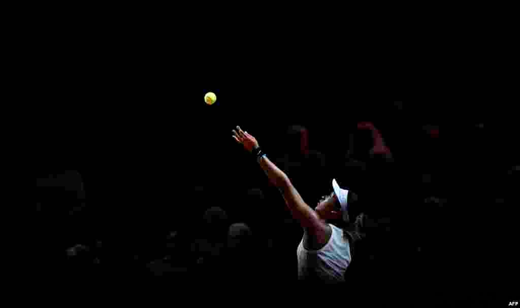 Japan's Naomi Osaka serves to Taiwan's Su-Wei Hsieh during play at the WTA Tennis Grand Prix in Stuttgart, Germany.