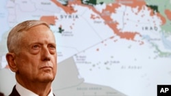 Secretary of Defense Jim Mattis stands in front of a map of Syria and Iraq, while speaking to the media about the Islamic State group at the Pentagon, May 19, 2017.