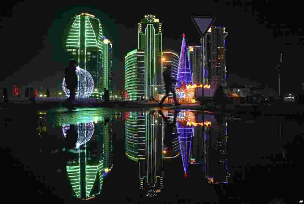 A Christmas tree and skyscrapers illuminated for New Year celebration are seen in downtown Grozny, the capital of Chechnya, Russia.