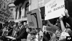 Iraqi Jews and others protest the hanging of 15 Iraqi citizens, including two Jews, outside the Iraqi Embassy to the UN in New York in 1969. 