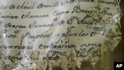 A yellow and deteriorating document is seen in the Historical Archives of the Catholic Diocese of St. Augustine, in St. Augustine, Floria, Jan. 27, 2013.