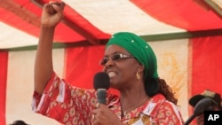 FILE - Grace Mugabe, Zimbabwe's first lady, addresses a rally in Chinhoyi, about 120 kilometers west of Harare, Oct. 2, 2014.