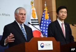 FILE - U.S. Secretary of State Rex Tillerson, left, speaks as South Korean Foreign Minister Yun Byung-se looks on during a press conference in Seoul, March 17, 2017.