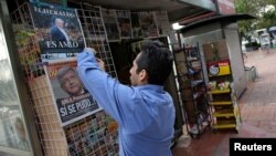 A vendor arranges newspapers at his stall after the election of Andres Manuel Lopez Obrador as the new president of Mexico, in Mexico City, July 2, 2018.
