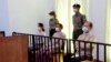 Myanmar’s Suu Kyi Appears in Court for First Time Since Arrest