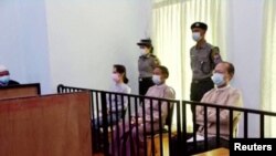 FILE - Myanmar's ousted leader Aung San Suu Kyi, former president Win Myint and doctor Myo Aung appear at a court in Naypyitaw, Myanmar May 24, 2021, in this still image taken from video. (MRTV/REUTERS TV/via REUTERS)