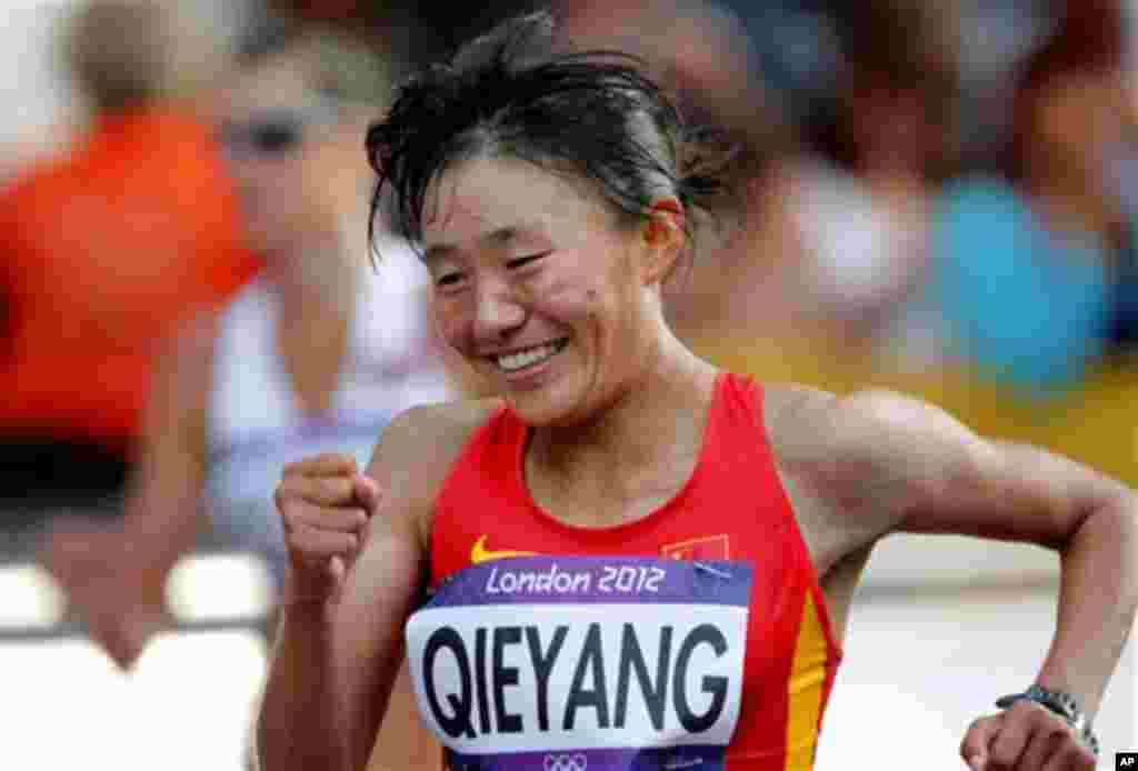 Choeying Kyi celebrates her third place finish in the women&#39;s 20-kilometer race walk at the 2012 Summer Olympics, Saturday, Aug. 11, 2012, in London. 