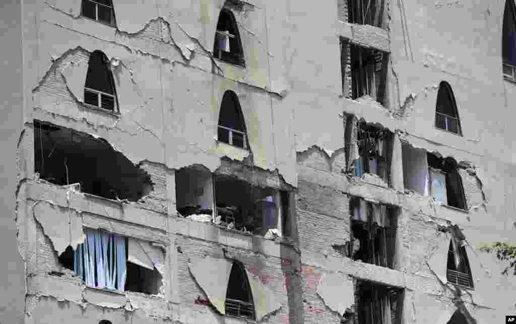 Remains of a damaged building stands after an earthquake in Mexico City, Tuesday, Sept. 19, 2017. A powerful earthquake has jolted Mexico, causing buildings to sway sickeningly in the capital on the anniversary of a 1985 quake that did major damage.