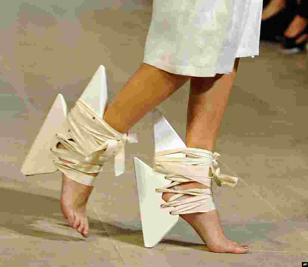 A model presents shoes for Fatima Lopes' ready-to-wear Spring/Summer 2014 fashion collection in Paris, France. 