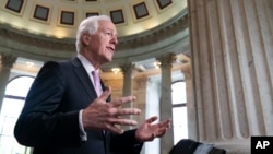 FILE - Majority Whip John Cornyn, R-Texas, takes questions during a TV news interview on Capitol Hill in Washington, April 26, 2018.