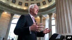 FILE - Majority Whip John Cornyn, R-Texas, takes questions during a TV news interview on Capitol Hill in Washington, April 26, 2018.