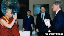 FILE - The Dalai Lama, Lodi Gyari, Al Gore and Bill Clinton in the Office of the Vice President, Washington, April 1993.