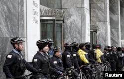 FILE - Chicago police block the main entance to Water Tower Place during a protest march against police violence in Chicago, Illinois, Dec. 24, 2015.