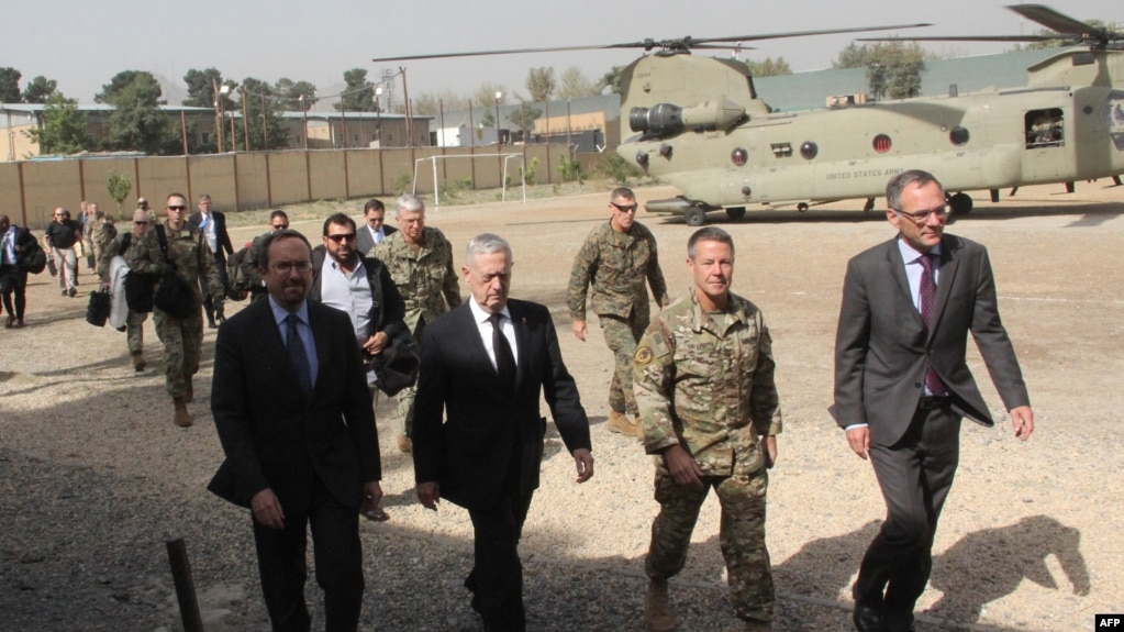 U.S. Defense Secretary Jim Mattis, second left, arrives at NATO's Resolute Support mission in Kabul, Afghanistan on Sept. 7, 2018. 