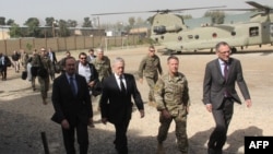 U.S. Defense Secretary Jim Mattis, second left, arrives at NATO's Resolute Support mission in Kabul, Afghanistan on Sept. 7, 2018. 