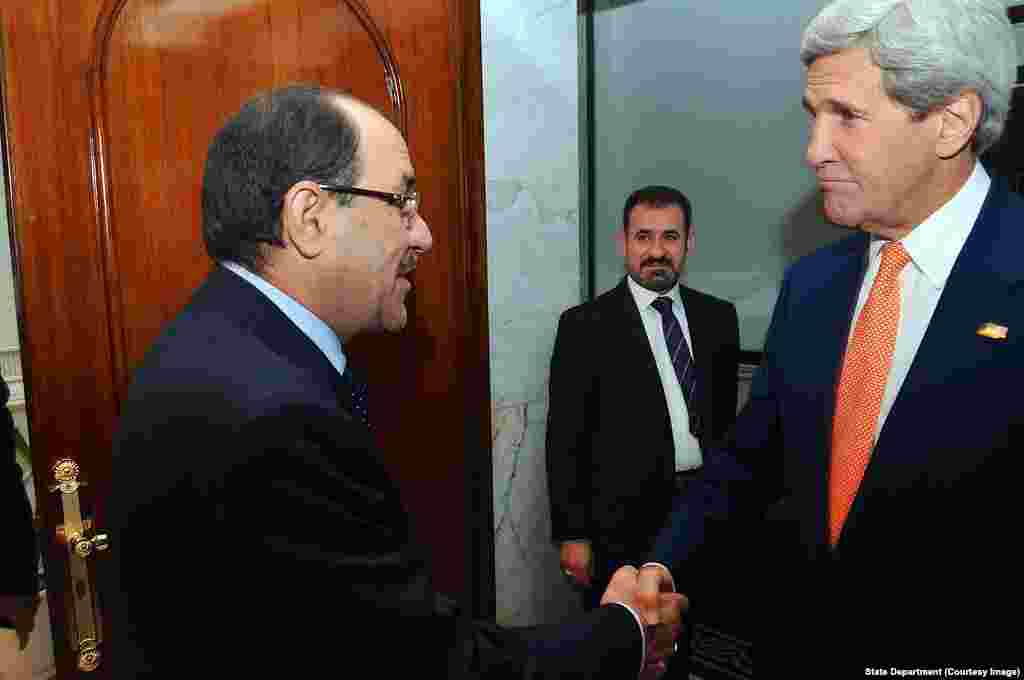 Iraqi Prime Minister al-Maliki Greets Secretary Kerry Upon Arrival for Meeting in Baghdad.