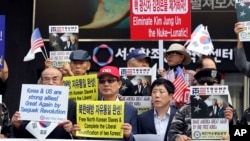 South Korean activists and North Korean defectors hold a rally against North Korea and the country's leader, Kim Jong Un, in downtown Seoul, South Korea, Sept. 8, 2017. The U.S. and South Korea are closely watching North Korea over the possibility it may launch another missile as it celebrates its founding anniversary.