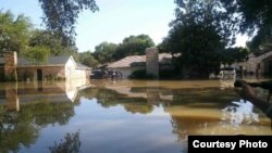 A street in Bear Creek Village is seen in this photo taken a week after Hurricane Harvey hit Texas in August 2017.