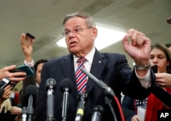Sen. Bob Menendez, D-N.J., speaks to members of the media after leaving a closed door meeting about Saudi Arabia with Secretary of State Mike Pompeo, Nov. 28, 2018, on Capitol Hill in Washington.