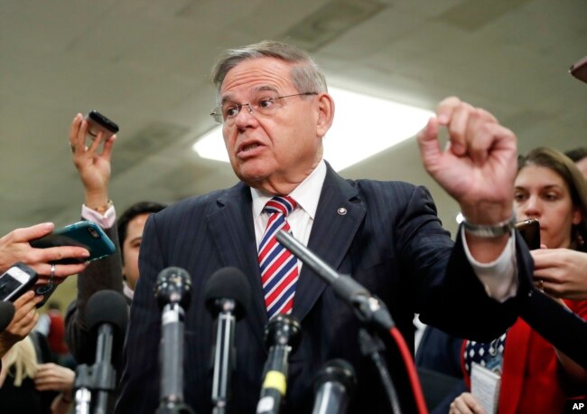 FILE - Sen. Bob Menendez, D-N.J., speaks to members of the media on Capitol Hill in Washington, Nov. 28, 2018.