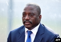 This file photo taken on February 3, 2015 shows the Democratic Republic of the Congo's President Joseph Kabila attending a training session of his country's football team in Bata.